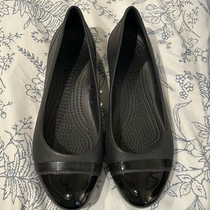 Crocs black slip on flats, size 11W